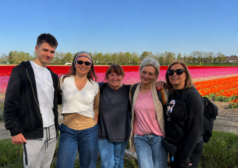 Participants posing together in Dutch tulip fields during Kronland’s Erasmus+ mobility project
