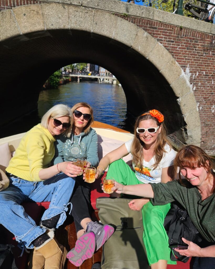 Participants of the Erasmus+ mobility project enjoying a boat tour through the canals of Amsterdam during a cultural visit in the Netherlands