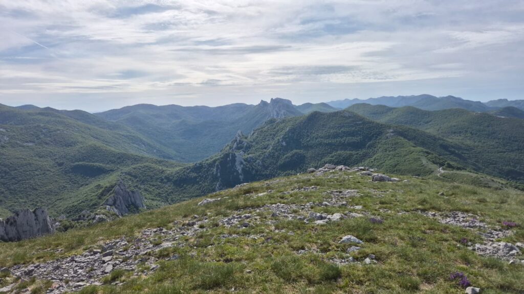 Panoramic view from Velebit Mountain showing the hiking route and the green mountain landscape during the 12 Peaks – Challenge Up project