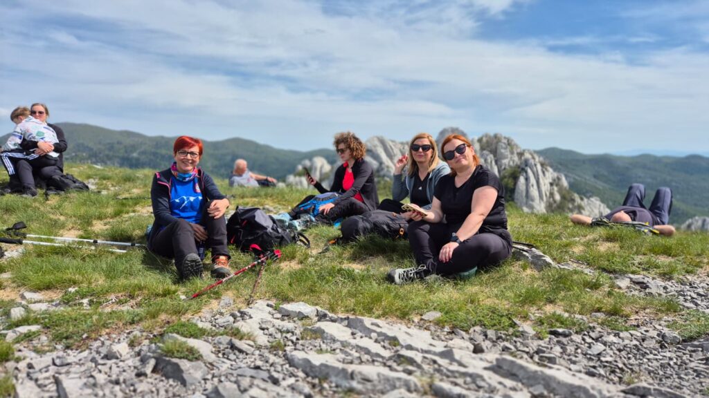 “Participants of the 12 Peaks – Challenge Up project resting together on Velebit Mountain and enjoying time in nature after the hike