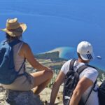 Participants of the 12 Peaks Challenge Up project on Vidova Gora, the highest peak of Brač Island, overlooking Zlatni Rat beach and the Adriatic Sea, Croatia.