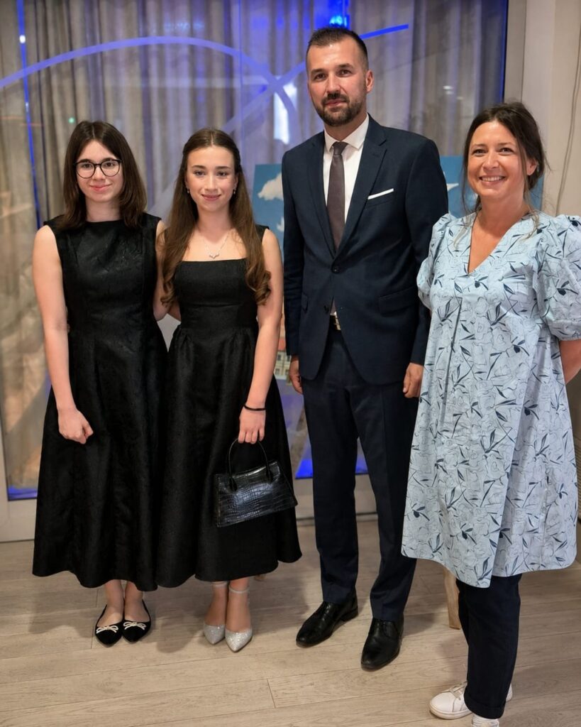 Four attendees posing together after the ceremonial session of the Sisak City Council, including musicians Sara and Tessa Kolar, City Council President Tomislav Kralj and Sandra Drnić.