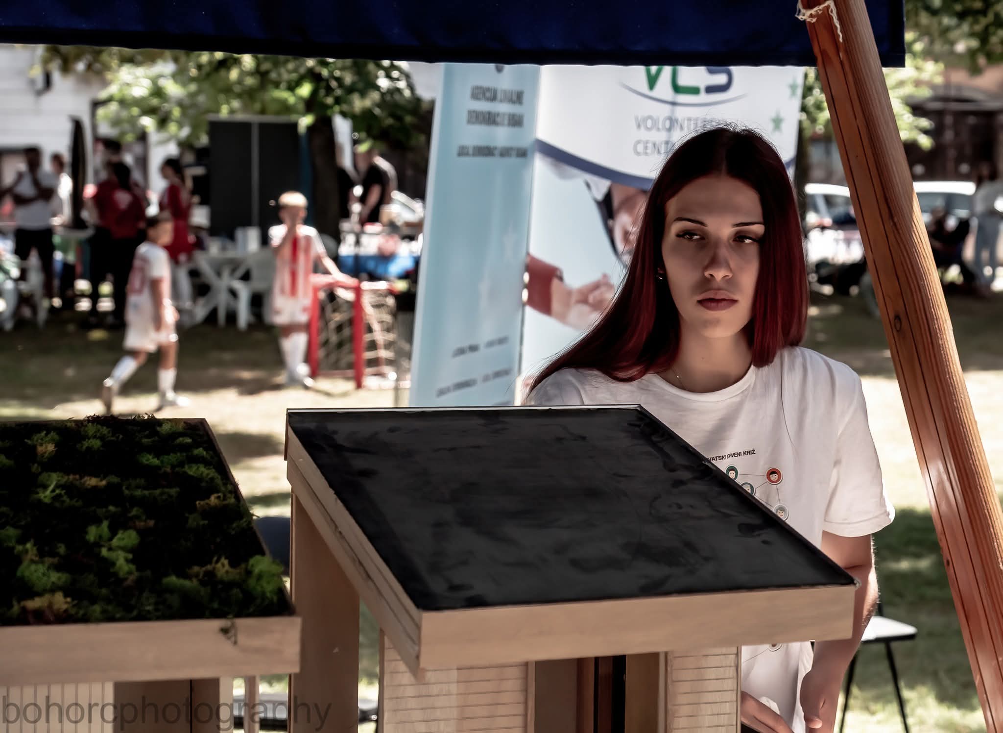 Matilda, volunteer of KroNland, presenting the Green Village Banovina model at the Sisak NGO Fair 2026.