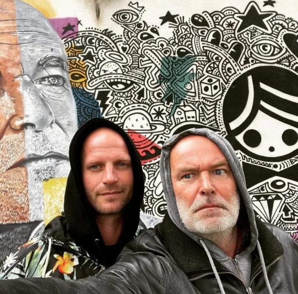 Artists Ottograph Amsterdam and Jarno Gnirrep in front of a mural created during the Amsterdam Street Art project in Hrvatska Kostajnica, Croatia